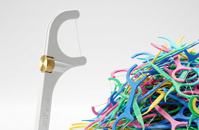 LastFloss beside a pile of the single-use plastic floss picks it replaces